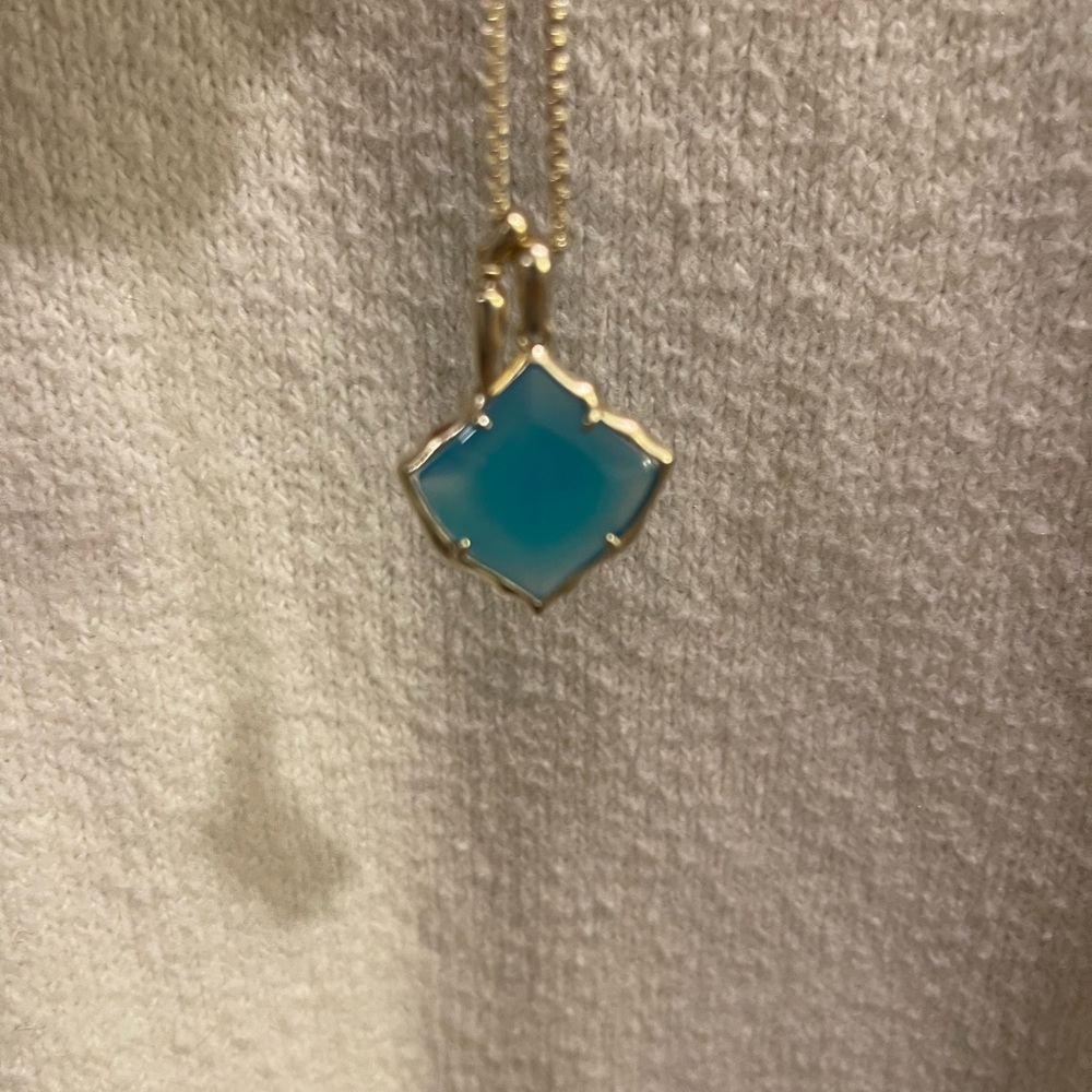 Kendra Scott gold necklace with pendant
